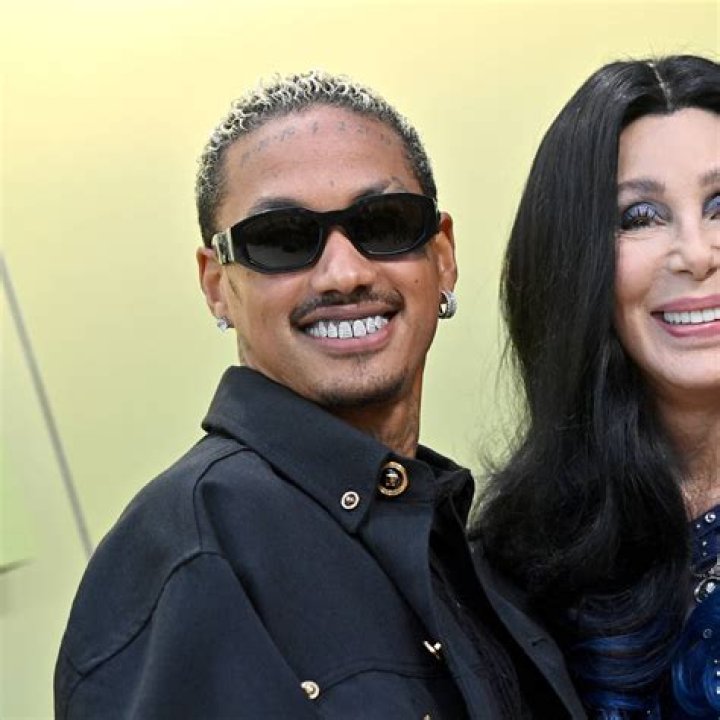Cher and Boyfriend Share Passionate Kiss During Red Carpet Debut Parade