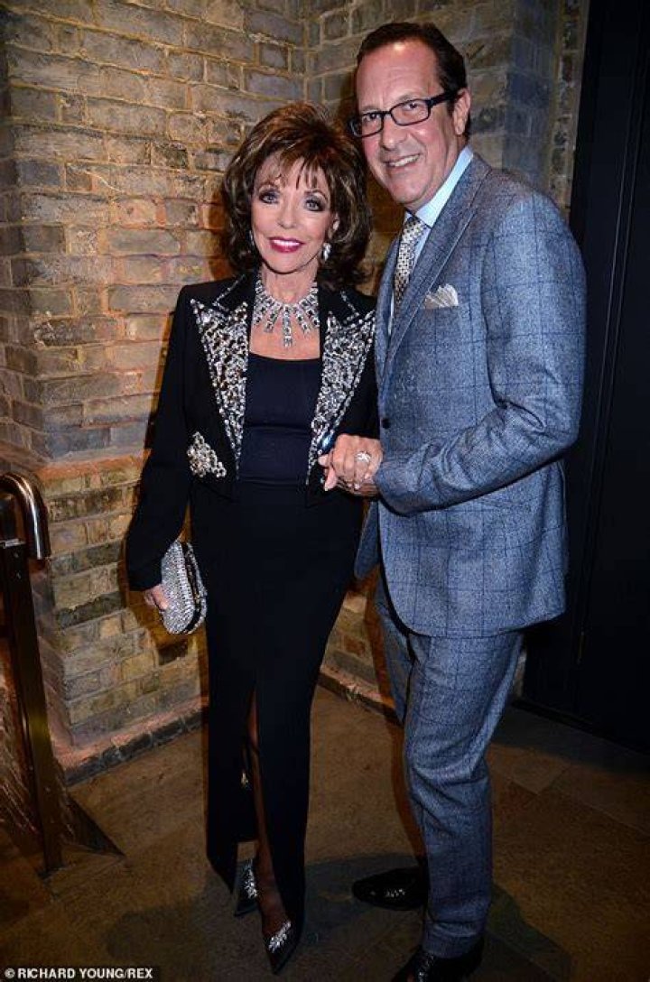 Joan Collins, 86, and husband Percy Gibson, 54, enjoy a romantic dinner