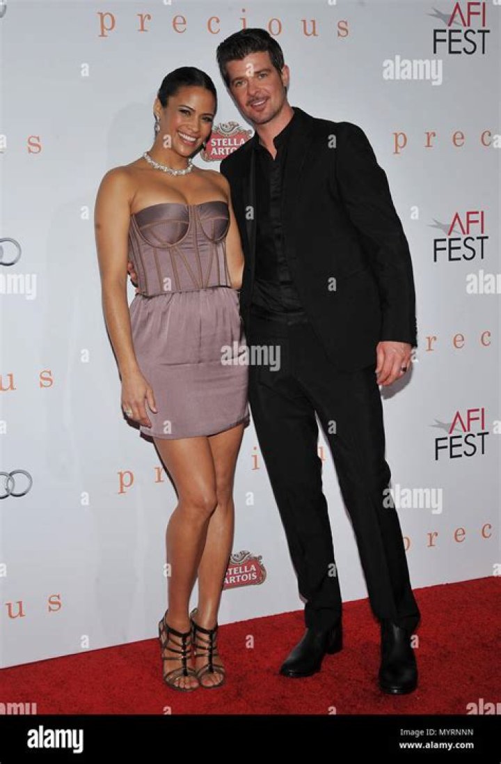 Paula Patton and husband Robin Thicke arrive at the Keep a Child Alive